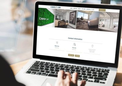 web design of Cawsey Law's website on a laptop, contact section