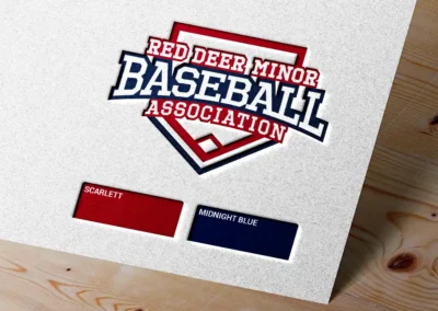 red deer minor baseball association logo embossed on a sheet of paper
