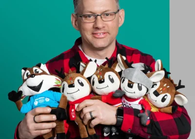 Brian holding canada winter games waskasoo stuffy toys
